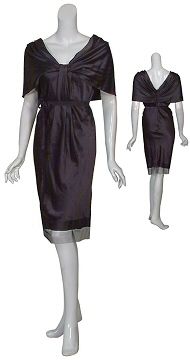 Sophisticated silk cocktail dress. Draped neckline is pleated at the 